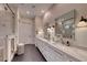 Elegant bathroom with double vanity and large shower at 116 Stone Mesa Ct, Henderson, NV 89011