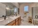Bathroom with double vanity and walk-in shower at 116 Stone Mesa Ct, Henderson, NV 89011