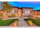 Beautiful home exterior with landscaping and lighting at 116 Stone Mesa Ct, Henderson, NV 89011