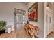 Elegant hallway with wood console table and art at 116 Stone Mesa Ct, Henderson, NV 89011