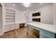 Bright home office features built-in shelving and hardwood floors at 116 Stone Mesa Ct, Henderson, NV 89011