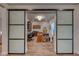 Home office with sliding glass doors and hardwood floors at 116 Stone Mesa Ct, Henderson, NV 89011