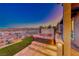 Hot tub on patio with mountain views and a glass of champagne at 116 Stone Mesa Ct, Henderson, NV 89011