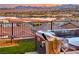 Hot tub with stunning lake and mountain views at sunset at 116 Stone Mesa Ct, Henderson, NV 89011