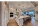 Modern kitchen with white cabinets, large island, and high-end appliances at 116 Stone Mesa Ct, Henderson, NV 89011