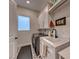 Laundry room with washer, dryer, and utility sink at 116 Stone Mesa Ct, Henderson, NV 89011