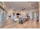 Spacious living room featuring hardwood floors, comfortable seating, and a fireplace at 116 Stone Mesa Ct, Henderson, NV 89011