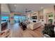 Living room boasts hardwood floors, fireplace, and access to a large patio with lake view at 116 Stone Mesa Ct, Henderson, NV 89011