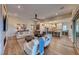 Open living room with hardwood floors and a view into a well-equipped kitchen at 116 Stone Mesa Ct, Henderson, NV 89011