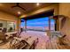 Covered patio with seating and lake views at 116 Stone Mesa Ct, Henderson, NV 89011