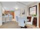 Bright dining area with a glass table and four light-colored chairs at 135 E Harmon Ave # 1621, Las Vegas, NV 89109