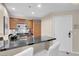 Modern kitchen with dark countertops and stainless steel appliances at 135 E Harmon Ave # 1621, Las Vegas, NV 89109