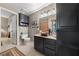 Bathroom with dark vanity, copper sink, and shower at 1500 Jenny Linn Dr # 1500, Henderson, NV 89014