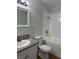 Updated bathroom with granite vanity and bathtub shower at 2112 Venus Ave # A, North Las Vegas, NV 89030