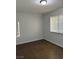 Simple bedroom with tile flooring and window coverings at 2112 Venus Ave # A, North Las Vegas, NV 89030