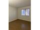 Bright bedroom with tile flooring and window blinds at 2112 Venus Ave # A, North Las Vegas, NV 89030