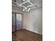 Dining room with mirrored ceiling and hardwood floors at 2112 Venus Ave # A, North Las Vegas, NV 89030