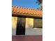 Front entrance with Spanish tile roof and security door at 2112 Venus Ave # A, North Las Vegas, NV 89030