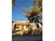 Spanish-style home with a red tile roof and mature landscaping at 2112 Venus Ave # A, North Las Vegas, NV 89030