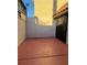 Red colored patio area with gated access at 2112 Venus Ave # A, North Las Vegas, NV 89030