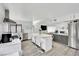 Gourmet kitchen with white cabinetry, breakfast bar, and pool view at 2712 Sidonia Ave, Las Vegas, NV 89102