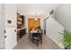 Bright dining room with a wooden table and built-in bar at 2876 Strathallan Ave, Henderson, NV 89044