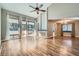 Living room with hardwood floors, fireplace, and sliding glass doors at 3031 Mirado Ct, Las Vegas, NV 89121