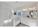 Elegant bathroom with double vanity, soaking tub, and shower at 436 Trevinca St, Las Vegas, NV 89138