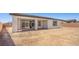 Large backyard with patio, block wall, and desert landscaping at 4540 S Pienza Ct, Pahrump, NV 89061