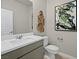 Clean bathroom with white sink, toilet, and modern decor at 4540 S Pienza Ct, Pahrump, NV 89061