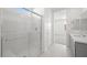 Bathroom with walk-in shower, gray cabinets, and tile flooring at 4540 S Pienza Ct, Pahrump, NV 89061