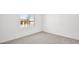 Bright bedroom with neutral carpet, large window and white walls at 4540 S Pienza Ct, Pahrump, NV 89061