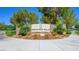 Stone monument sign surrounded by desert landscaping welcomes residents and guests to Mountain Falls at 4540 S Pienza Ct, Pahrump, NV 89061