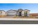 Charming single-story home with a well-manicured front yard and a two-car garage on a clear day at 4540 S Pienza Ct, Pahrump, NV 89061