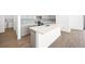 Kitchen island with quartz countertop and stainless steel sink at 4540 S Pienza Ct, Pahrump, NV 89061