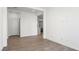 Spacious living room with wood-look floors and access to other rooms in the home at 4540 S Pienza Ct, Pahrump, NV 89061