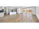 Open-concept living room features a kitchen island and access to the backyard at 4540 S Pienza Ct, Pahrump, NV 89061