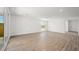 Spacious living room with wood-look tile flooring and ample natural light at 4540 S Pienza Ct, Pahrump, NV 89061