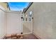 White vinyl fence with a gate providing access to the backyard at 524 Blackbird Knoll Ct, North Las Vegas, NV 89084