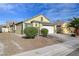 Another view of the house exterior, highlighting the landscaping and garage at 524 Blackbird Knoll Ct, North Las Vegas, NV 89084