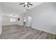 Spacious living room with wood-look floors and an open floor plan at 524 Blackbird Knoll Ct, North Las Vegas, NV 89084