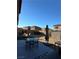 Patio with table and chairs, storage shed, and artificial turf at 616 Taliput Palm Pl, Henderson, NV 89011