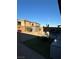 Backyard with patio furniture, storage shed, and artificial turf at 616 Taliput Palm Pl, Henderson, NV 89011