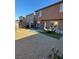 Spacious backyard with patio furniture, storage shed, and artificial grass at 616 Taliput Palm Pl, Henderson, NV 89011