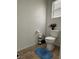 Clean bathroom with toilet, tile floor, and updated fixtures at 616 Taliput Palm Pl, Henderson, NV 89011
