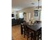 Bright dining area with a large table and access to the living room at 616 Taliput Palm Pl, Henderson, NV 89011
