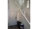 Bright entryway with staircase, door, and shoe rack at 616 Taliput Palm Pl, Henderson, NV 89011