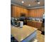Kitchen with light brown cabinets, granite countertops, and stainless steel appliances at 616 Taliput Palm Pl, Henderson, NV 89011