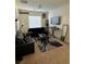 Spacious living room with a large TV and ample seating at 616 Taliput Palm Pl, Henderson, NV 89011