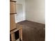 Simple carpeted bedroom with a door to hallway at 6955 N Durango Dr # 1077, Las Vegas, NV 89149